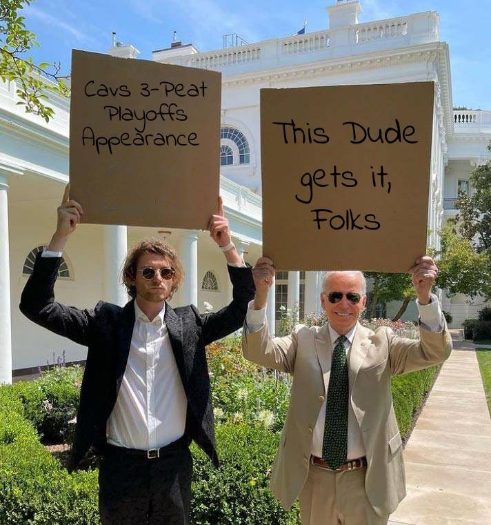 Biden And Dude With Sign .jpg